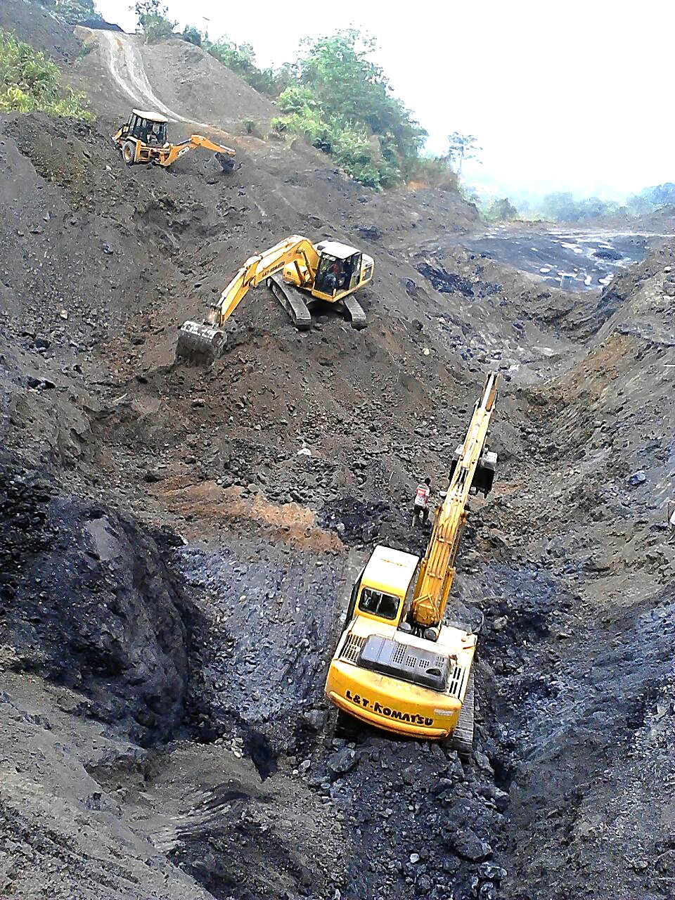 Earth moving machineries seen scoop digging at an open cast coal mining site in Mokokchung district recently. Coal trading in Nagaland continues even in the face of a standing government order forbidding coal mining. (Morung file photo)